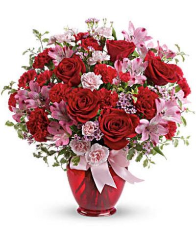 <div id="mark-3" class="m-pdp-tabs-marketing-description">Love is bliss! Celebrate your special connection with this romantic bouquet of red roses mixed with flirty pink blooms. Arranged in a red jar and tied up with a bow, it's a loving way to make her feel extra special, on Valentine's Day or any day of the year!</div>
<div id="desc-3">
<ul>
 	<li>Lush red roses, pink alstroemeria, red carnations, miniature red carnations, miniature pink carnations and pink waxflower are arranged with pitta negra and lemon leaf.</li>
</ul>
</div>