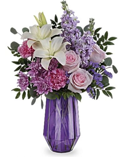 <div id="mark-3" class="m-pdp-tabs-marketing-description">
<div id="mark-3" class="m-pdp-tabs-marketing-description">Wish her a Mother's Day of wonder and whimsy with a breathtaking rose and lily bouquet in this stunning geometric glass vase.</div>
<p>&nbsp;</p>
<div id="desc-3">Light pink roses, white asiatic lilies, pink carnations, lavender stock and lavender cushion spray chrysanthemums are arranged with lavender sinuata statice, silver dollar eucalyptus and huckleberry.</div>
</div>