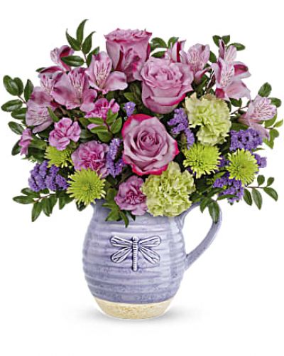<div id="mark-3" class="m-pdp-tabs-marketing-description">Pour on the love with this wonderfully whimsical Mother's Day gift! Bursting with a colorful bouquet, this glazed ceramic pitcher is as practical as it is charming--it's food-safe so mom can enjoy it on her breakfast table for years to come!</div>
<p>&nbsp;</p>
<div id="desc-3">Lavender roses, green carnations, purple sinuata statice, lavender alstroemeria, green cushion spray chrysanthemums and miniature lavender carnations are arranged with huckleberry.</div>