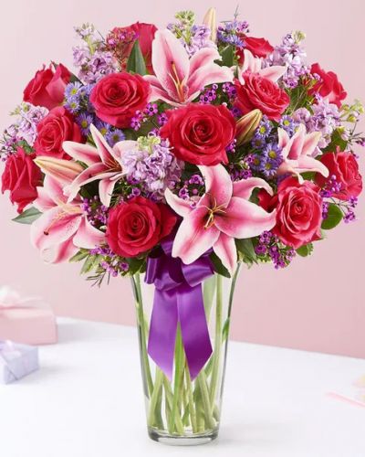 A gift means so much more when it comes from the heart. Our Valentine’s bouquet delivers on that sentiment, with radiant pink and purple blooms arranged in a glass cylinder vase. Finished with a purple satin ribbon, it’s a surprise that speaks volumes about how you feel.