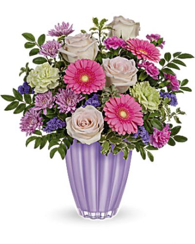 <div id="mark-3" class="m-pdp-tabs-marketing-description">Put a spring in their step with this playful bouquet of pink and purple blooms, presented to perfection in a pastel purple vase of European glass with radiant metallic finish.</div>
<p>&nbsp;</p>
<div id="desc-3">Blush roses, miniature pink gerberas, green carnations, miniature hot pink carnations and lavender cushion spray chrysanthemums are arranged with huckleberry and pitta negra. res</div>