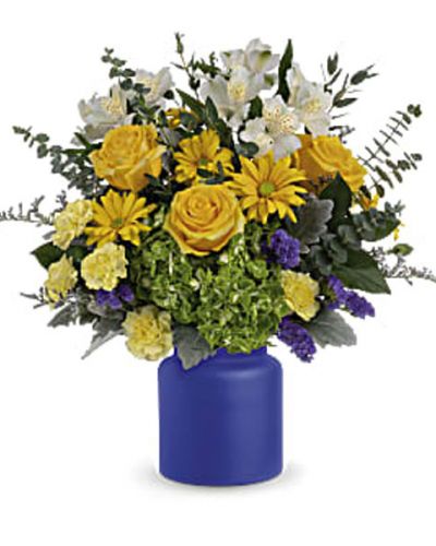 <p>Capture the magic of a sunrise at sea with this radiant white and yellow bouquet, arranged in a frosted glass vase the color of the deep ocean.</p>