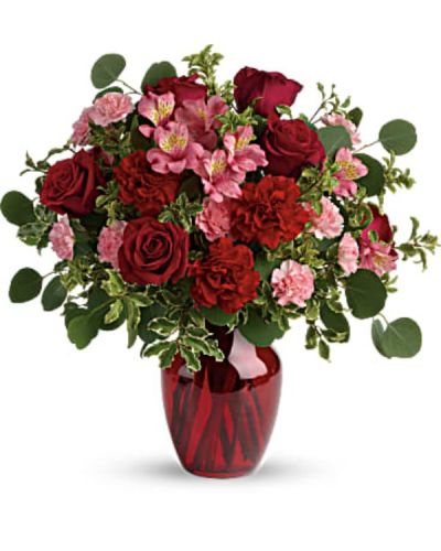 <div id="mark-3" class="m-pdp-tabs-marketing-description">Tres belle! Ruby red roses and delicate pink alstroemeria are mixed with whimsical greens in a radiant vase for a beautifully blooming gift she'll never forget!</div>
<div id="desc-3">
<ul>
 	<li>Red roses, pink alstroemeria, red carnations, and pink miniature carnations are accented with silver dollar eucalyptus and pitta negra.</li>
 	<li>Delivered in a ruby rose vase.</li>
</ul>
</div>
