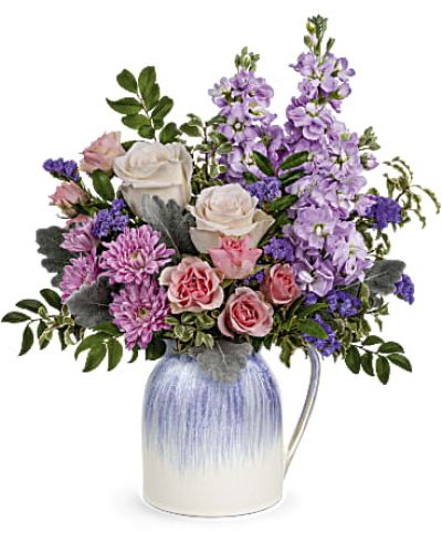 <p>This spring, pour on the pretty with lush pastel blooms presented in this charming ceramic pitcher with iridescent lavender glaze. It's food safe for years of versatile enjoyment!</p>
<div id="tabs-pdp-content" class="tab-content">
<div id="description" class="tab-pane fade active">
<p>&nbsp;</p>
<div id="desc-3">Pink spray roses, lavender stock, lavender cushion spray chrysanthemums and purple sinuata statice are arranged with dusty miller, huckleberry and pitta negra.</div>
</div>
</div>