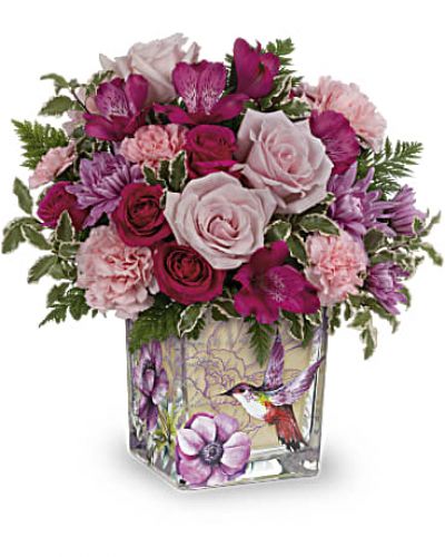 <ul id="tabs-pdp" class="nav nav-tabs" data-tabs="tabs"></ul>
<div id="tabs-pdp-content" class="tab-content">
<div id="description" class="tab-pane fade active">
<div id="mark-3" class="m-pdp-tabs-marketing-description">Like a hummingbird flitting around a secret garden, this delightful bouquet of pink roses in a vintage-inspired glass cube is a magical gift on Mother's Day or any special occasion.</div>
<p>&nbsp;</p>
<div id="desc-3">This beautiful bouquet includes hot pink spray roses, dark pink alstroemeria, lavender cushion spray chrysanthemums, pink carnations, miniature pink carnations, leatherleaf fern and pitta negra.</div>
</div>
</div>