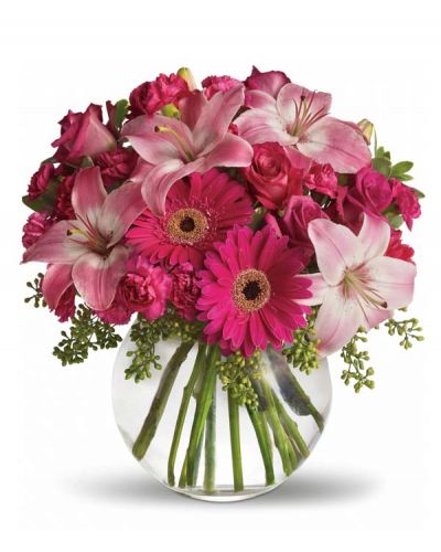 <p>Youthful. Graceful. Beautiful ... she'll be Tickled Pink by this gorgeous bouquet of flowers. Lovely pink roses and Asiatic lilies are joined by hot pink gerberas and miniature carnations, pink full-sized carnations and more in a clear glass ball. Whether you want this arrangement to say "Happy Anniversary" or "Happy Any Day," you can be sure the day it arrives will be brighter for anyone lucky enough to receive it.</p>