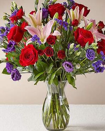 This dreamy jewel toned bouquet combines bold color and eye catching texture to make a statement. Featuring a thoughtful array of both roses and lilies, this dazzling assortment is bound to impress your recipient.

STANDARD

C Quantity Color Description
5 Red 50 cm Standard Rose
2 Pink LA Hybrid Lily
1 Purple Lisianthus - Double
3 Red Spray Rose
3 Purple Filler - Sinuata Statice
3 Green Green - Salal Tips

DELUXE

C Quantity Color Description
7 Red 50 cm Standard Rose
2 Pink LA Hybrid Lily
5 Purple Lisianthus - Double
5 Red Spray Rose
3 Purple Filler - Sinuata Statice
3 Green Green - Salal Tips

PREMIUM
C Quantity Color Description
10 Red 50 cm Standard Rose
3 Pink LA Hybrid Lily
6 Purple Lisianthus - Double
5 Red Spray Rose
3 Purple Filler - Sinuata Statice
3 Green Green - Salal Tips